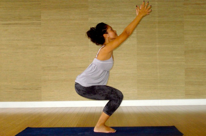 Utkatasana Chair Pose by a pregnant lady for normal delivery